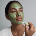 Applying Green Cream Retinol to Face