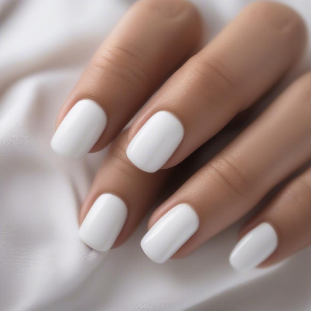 Step-by-step application of white nail polish 