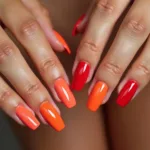 Coral and red nail polish on tan skin