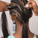 Applying Braid Tension Spray to Freshly Braided Hair