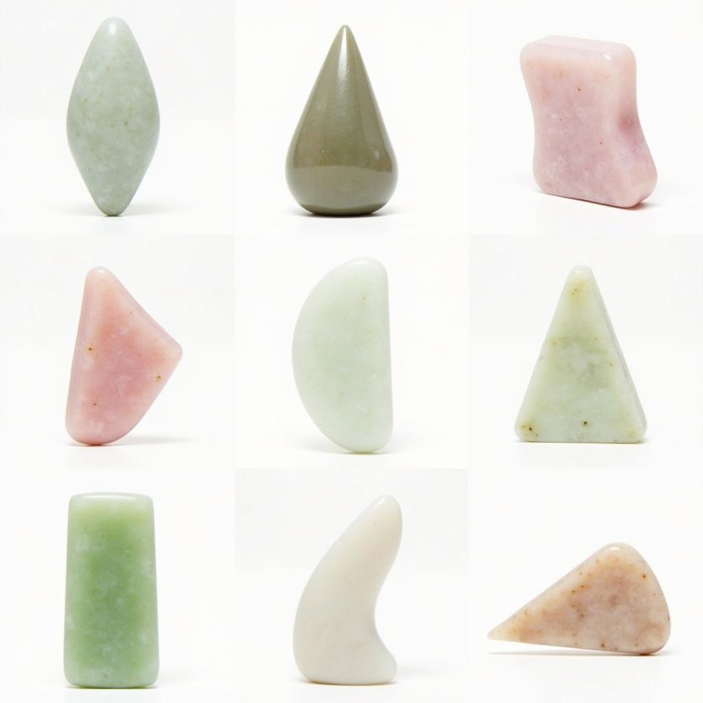 Different types of Gua Sha tools for body made of various materials like jade, rose quartz, and bian stone.