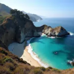 Panoramic view of the Big Sur coastline with a secluded beach in the foreground, highlighting the natural beauty and privacy that make it ideal for clothing optional experiences.