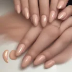 Nude peach nail polish swatches on various skin tones, demonstrating its versatility.