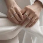 Close up of two hands wearing matching touch couple rings