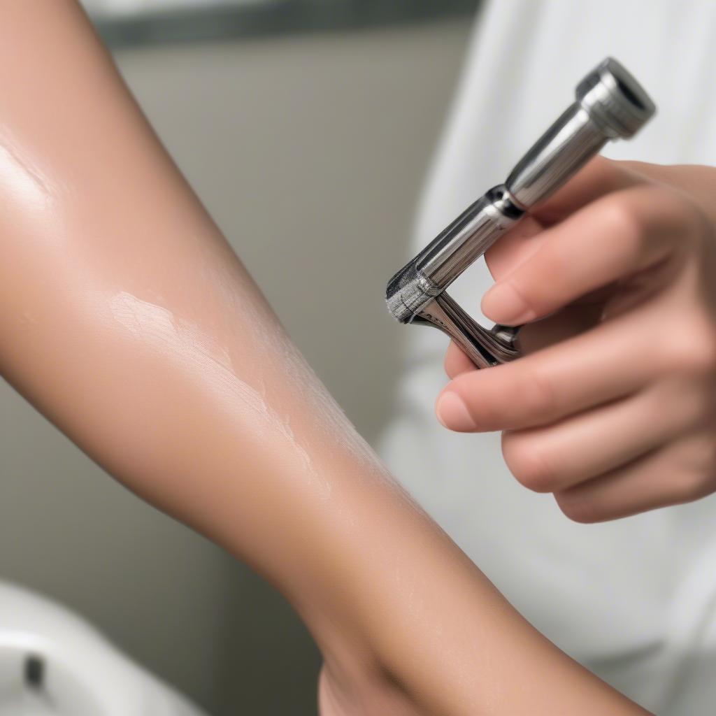 Woman Shaving Legs with Safety Razor