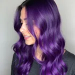 A Woman with Vibrant Purple Hair Styled with Color Styling Mousse