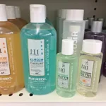 Various bottles of all clear shampoo on a shelf