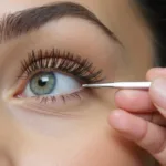 Applying individual eyelashes using tweezers