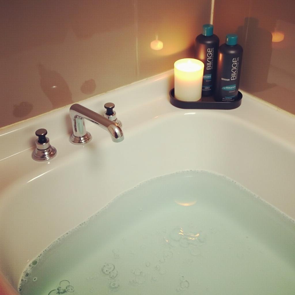 A relaxing bath setting with a Biolage candle and hair care products.