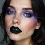 Close-up of a model wearing black lipstick and an iris-inspired eye makeup