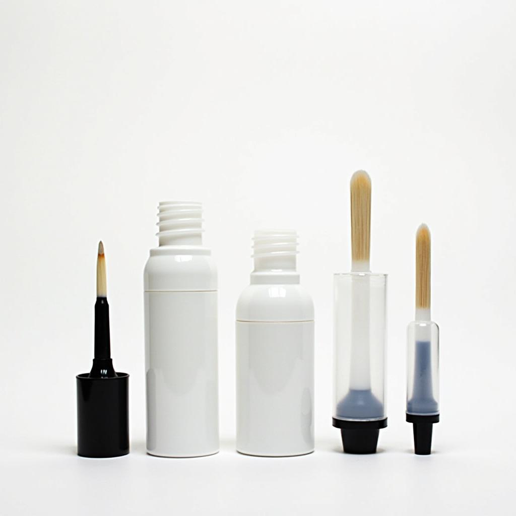 Various sizes of bottles with applicator brushes for diverse applications