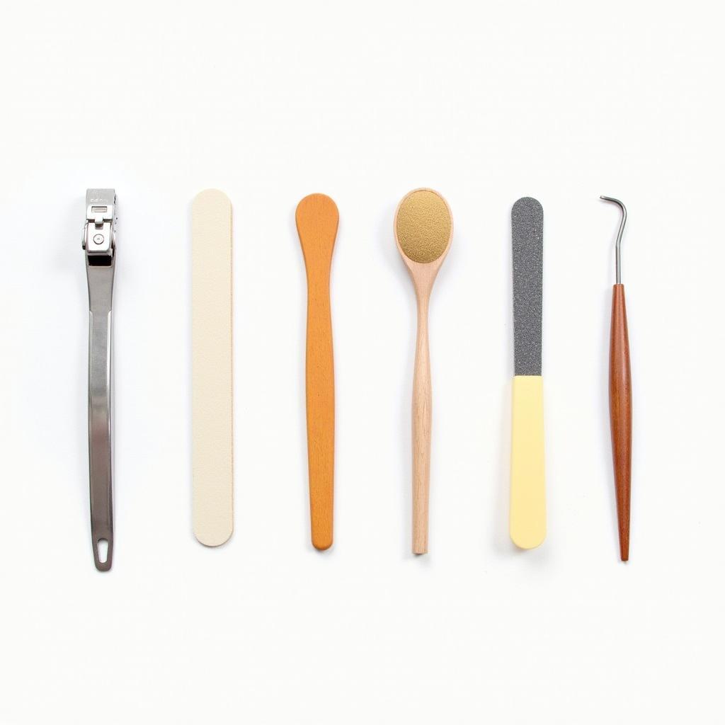 An array of nail care tools, including clippers, files, buffers, and cuticle pushers.