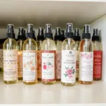 Various floral body mists displayed on a shelf