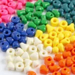 Assortment of colorful jumbo pony beads in various shapes and sizes.