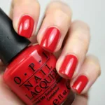 Applying OPI Red My Fortune Cookie