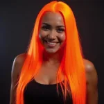 Woman with Vibrant Orange Neon Hair Smiling Confidently