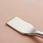 Close-up of a sonic spatula showing its metal blade